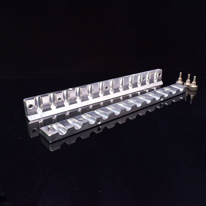 Open 12.1 mm lipstick mold showing the bird-beak cavity profile