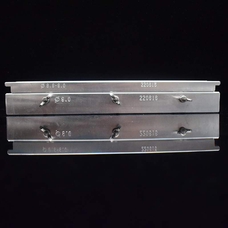 Mini bird-beak lipstick mold marked with a 9.0 mm diameter