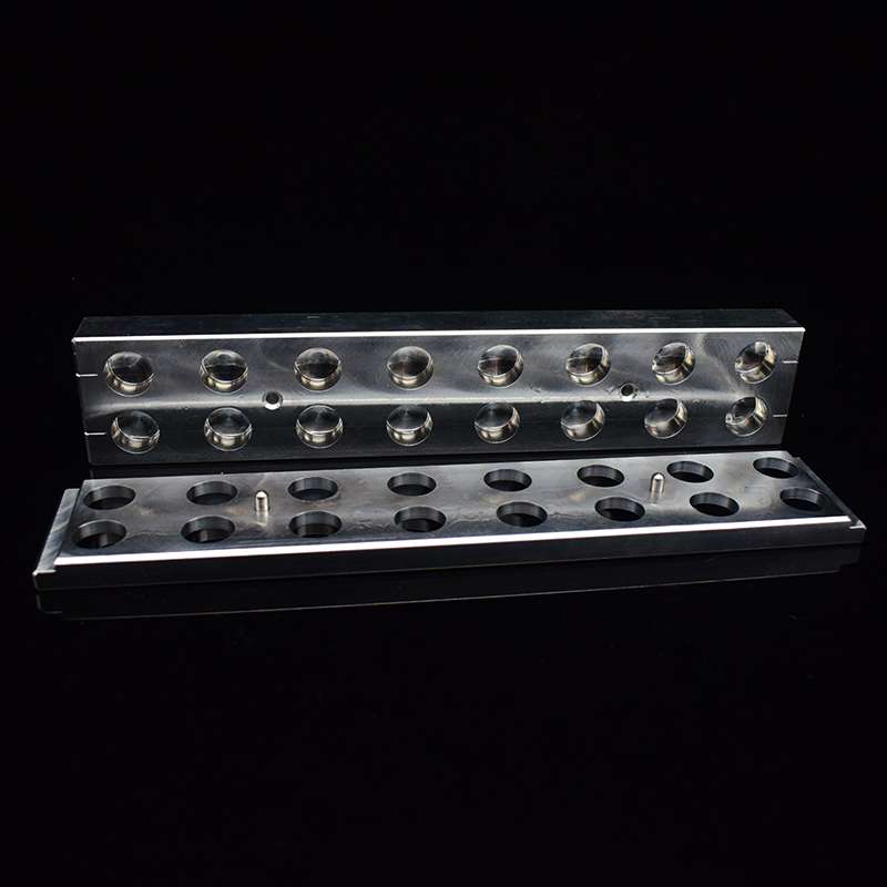Open 16-cavity concealer stick mold showing both mold sections