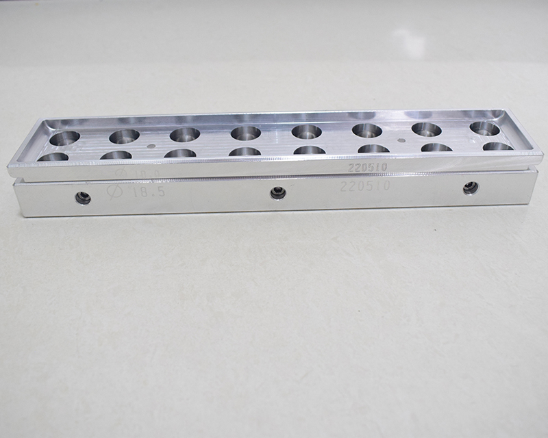 Complete 16-cavity concealer stick filling mold on a light background